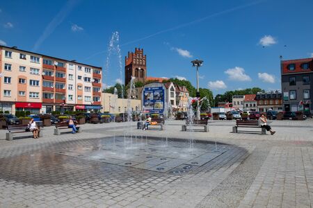 Lebork, Pomeranian Voivodeship / Poland - June 6, 2019: The newly renovated market of a small town in Pomerania. Historic tenements in a small city in Central Europe. Spring season.のeditorial素材