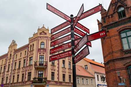 Chelmno, kujawskopomorskie / Poland - June 13, 2019: Old buildings in the center of a small town in Central Europe. Historic tenement houses and a church surrounding the old town square. Summer season.のeditorial素材