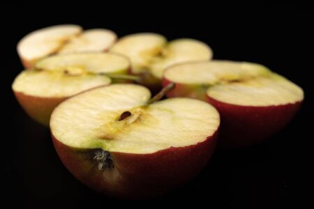 Tasty ripe apple on a dark table. Rich berries prepared to eat. Black background.