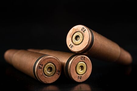 Ammunition of a high-speed rifle. Cartridges for a military rifle. Dark background.の写真素材