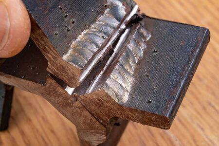The fillet weld is rubbed with a angle grinder. Destructive method for checking steel connections....