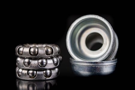 Replacing the bicycle wheel bearing. Bicycle parts service in the workshop. Dark background.の写真素材