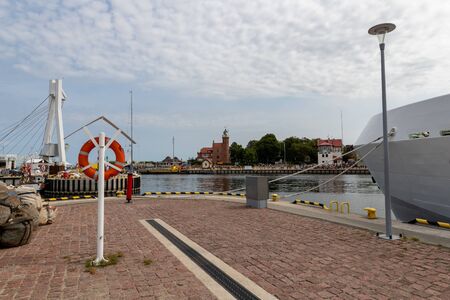 Ustka, Pomeranian / Poland - August 7, 2019: View of the fishing port on the Baltic Sea. Harbor buildings in a small town in Central Europe. Summer season.のeditorial素材