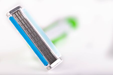 Male razor on a white table. Personal hygiene accessories. Light background.の写真素材