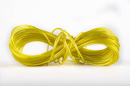 Washing rope curled up into a ball. Strong string for hanging underwear outside. Light background