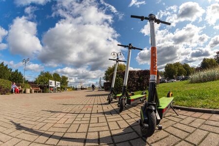 Gdynia, pomorskie / Poland-September, 18,2019: j. Parked electric scooters in the square in Gdynia. New urban transport in large cities. Autumn season.のeditorial素材