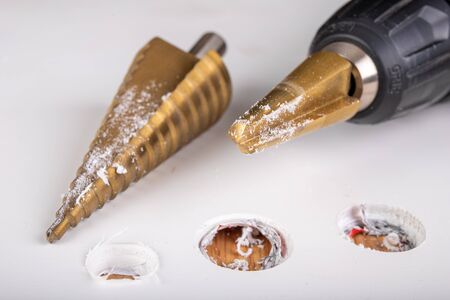 Conical drill used for small housework. Drilling in plastic with tool steel drills. Light...