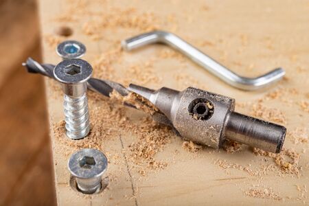 Confirmat screw used in connecting chipboard. Connections used in furniture making. Light...