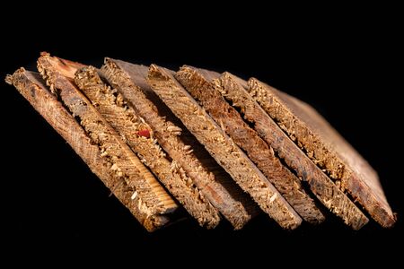Raw wooden boards. Heavily jagged wood edges. Dark background.の写真素材