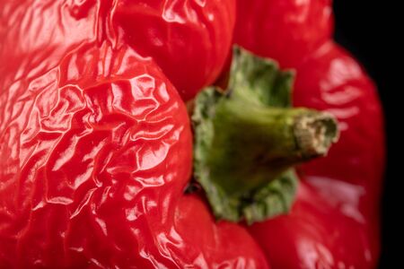 Wrinkled sweet pepper on the table. Dried old vegetables. Dark background.の写真素材
