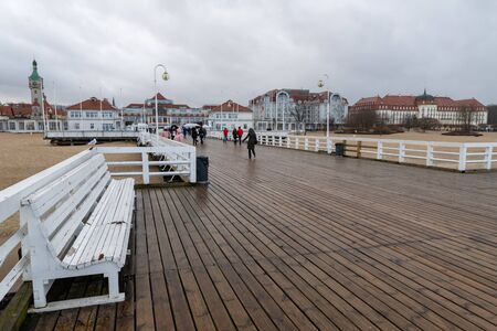 Sopot, Pomeranian / Poland - February, 04, 2020: Pier in Sopot on a rainy day. A large wooden bridge in Central Europe. Spring season.のeditorial素材