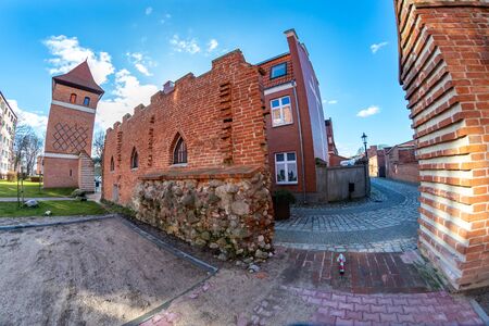 Lebork, pomorskie / Poland - February, 07, 2020: Old city walls of red brick. Middle-age buildings in Central Europe. Spring season.のeditorial素材