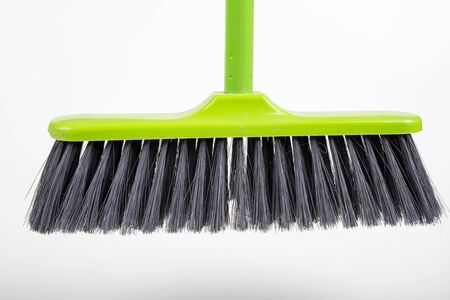 A new cleaning broom. Accessories to keep things tidy. Light background.の写真素材