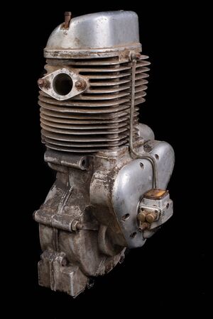 Old slightly dirty motor speedway motorcycle. Single-cylinder engine powered by ethanol. Dark background.の写真素材