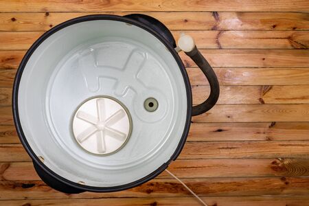 Old washing machine for washing clothes and underwear. Electric accessories for household work....