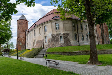 Swidwin, zachodniopomorskie / Poland - May, 29, 2020: Old knight's castle in the city center. Brick building in Central Europe. Spring season.のeditorial素材