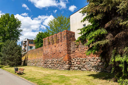 Slupsk, pomorskie / Poland - June, 3, 2020: City walls built of red brick. Brick building in Central Europe. Spring season.のeditorial素材