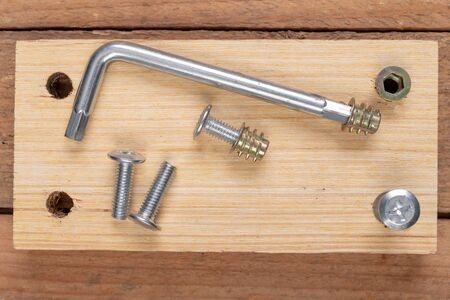 Special screws for joining wood. Carpentry accessories for building furniture. Workplace - workshop.