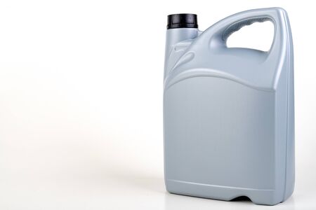 Oil container for passenger car. Maintenance accessories for vehicles for private use. Light background.の写真素材