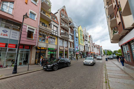 Kolobrzeg, zachodniopomorskie / Poland-July, 9, 2020: New and old tenements in the port city. Buildings in the city center. Summer season.のeditorial素材