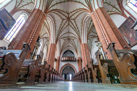 Chelmza, kujawsko pomorskie / Poland-July, 15, 2020: Historic interiors of a large Gothic church. Christian temple in the city center. Summer season.のeditorial素材