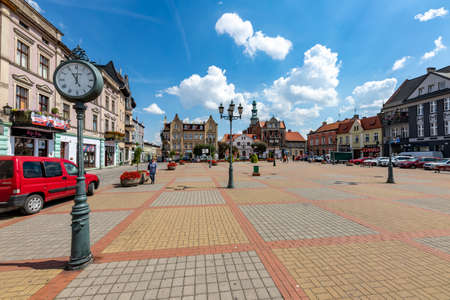 Chelmza, kujawsko pomorskie / Poland-July, 15, 2020: Small town market in Central Europe. Church and tenement houses in the city center. Summer season.のeditorial素材