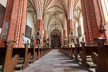 Chelmza, kujawsko pomorskie / Poland-July, 15, 2020: Historic interiors of a large Gothic church. Christian temple in the city center. Summer season.のeditorial素材