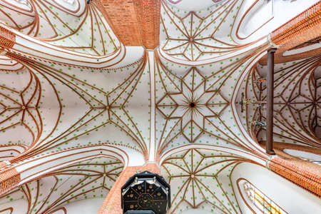 Chelmza, kujawsko pomorskie / Poland-July, 15, 2020: Historic interiors of a large Gothic church. Christian temple in the city center. Summer season.のeditorial素材