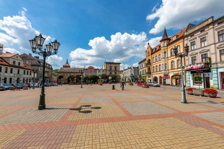 Chelmza, kujawsko pomorskie / Poland-July, 15, 2020: Small town market in Central Europe. Church and tenement houses in the city center. Summer season.のeditorial素材