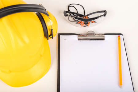 White sheet on a stiff base. Work accessories for production workers. Light background.