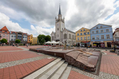 Bytow, pomorskie / Poland - July, 17, 2020: Church and market in a small town. City center in a Central European city. Summer season.のeditorial素材