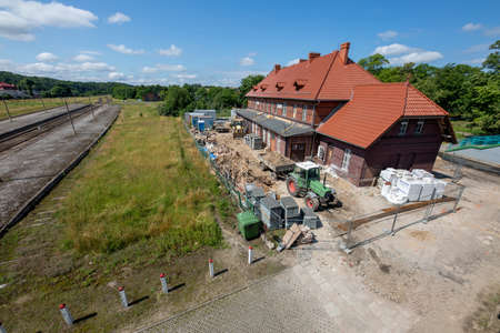 Bytow, pomorskie / Poland - July, 17, 2020: Renovation of the railway station building in Central Europe. Historic railway station in Central Europe. Summer season.のeditorial素材