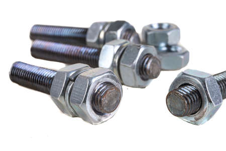 Metal bolts, washers and nuts with metric thread. Accessories for mounting metal elements. Light background.の写真素材