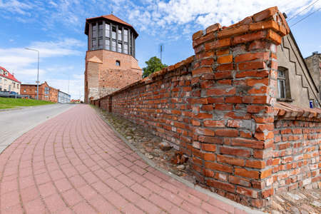 Debrzno, Pomorskie / Poland - July, 23, 2020: Renovated defensive tower. Medieval building converted into a cafe. Summer season.のeditorial素材