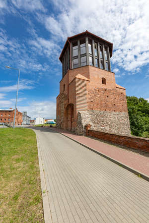 Debrzno, Pomorskie / Poland - July, 23, 2020: Renovated defensive tower. Medieval building converted into a cafe. Summer season.のeditorial素材