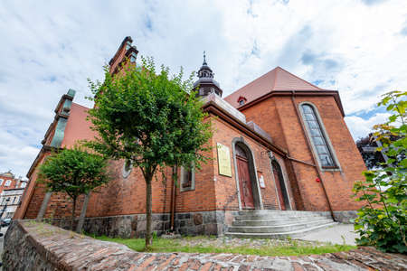 Koscierzyna, pomorskie / Poland - July, 24, 2020: Catholic Church in a small town. Christian temple in Central Europe. Summer season.のeditorial素材