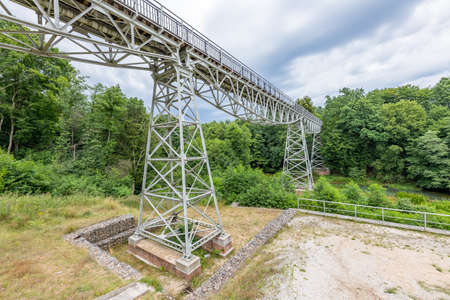 Koronowo, kujawsko pomorskie / Poland - July, 28, 2020: Metal structure of the narrow-gauge railway bridge. Old river crossing for rail vehicles. Summer season.のeditorial素材