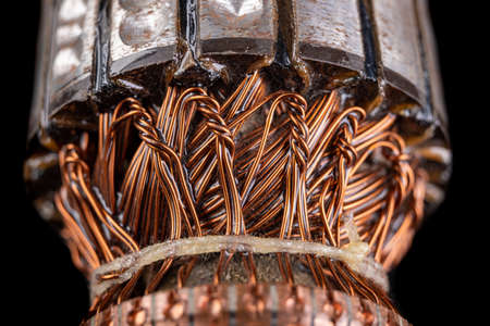 Electric rotor winding. Close-up of the copper cables on the rotor winding. Dark background.の写真素材