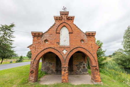 Wilcze Blota, Pomorskie / Poland - July, 31, 2020: Building of an old forge in a small village. An old brick building for a craftsman. Summer season.のeditorial素材