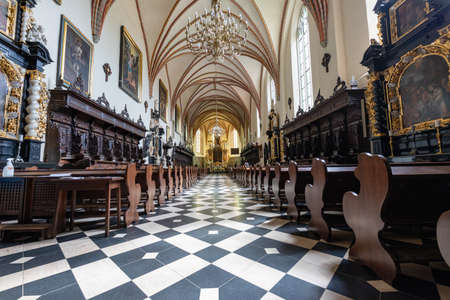 Kartuzy, pomorskie / Poland - August, 04, 2020: Inside a collegiate church in a small town. The altar and pews in the church. Summer season.のeditorial素材