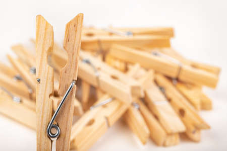 Wooden clothes pegs. Household accessories. White background.の写真素材