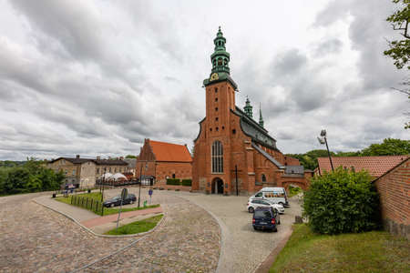 Kartuzy, pomorskie / Poland - August, 04, 2020: Collegiate school in a small town. Old Christian Church in Central Europe. Summer season.のeditorial素材