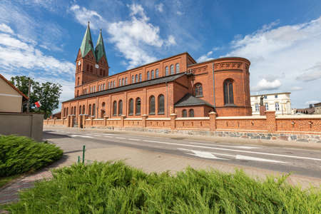 Brusy, pomorskie / Poland - August, 04, 2020: A large Christian church in Central Europe. Brick building in a small town. Summer season.のeditorial素材