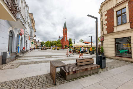 Kartuzy, pomorskie / Poland - August, 04, 2020: Pedestrian street leading to the market square in a small town. Old tenement houses in Central Europe. Summer season.のeditorial素材