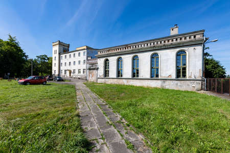 Potulice, kujawsko pomorskie / Poland - August, 05, 2020: Rebuilt palace building in Poland. Former palace in a small town. Summer season.のeditorial素材