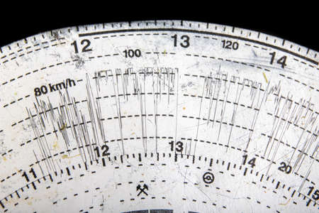 Paper tachograph dial. Professional driver's route. Light background.の写真素材