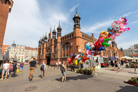 Gdansk, pomorskie / Poland - August, 8, 2020: Historic market hall in Gdansk. Historic tenement houses in the city of Central Europe. Summer season.のeditorial素材