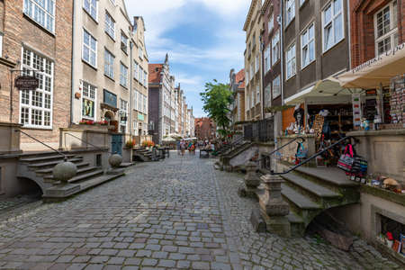Gdansk, pomorskie / Poland - August, 8, 2020: Mariacka Street with beautifully decorated buildings. Historic tenement houses in the city of Central Europe. Summer season.のeditorial素材