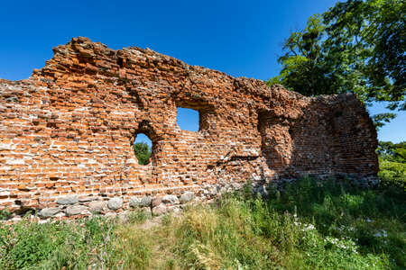 Szubin, kujawsko pomorskie / Poland - August, 12, 2020: Brick ruins of the castle in Szubin. Remains of the seat of PÅukÃ³w. Summer season.のeditorial素材