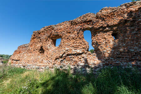 Szubin, kujawsko pomorskie / Poland - August, 12, 2020: Brick ruins of the castle in Szubin. Remains of the seat of PÅukÃ³w. Summer season.のeditorial素材